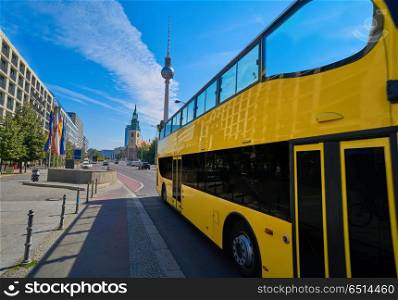 Berlin yellow tourist bus near Berliner Dom. Berlin yellow tourist bus near Berliner Dom in Germany