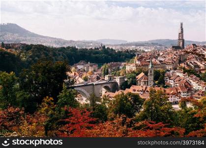 Bern old town with Evangelical church bell tower view from Rosengarten park in autumn season