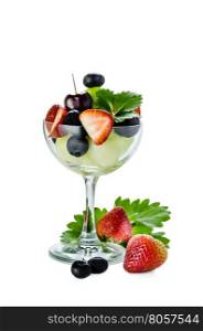 berries and melon. Fresh forest berries and melon in a glass on a white background isolated