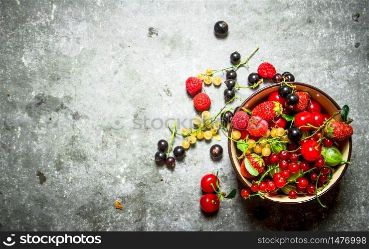 Berries in a Cup. On the stone table.. Berries in a Cup. On stone table.