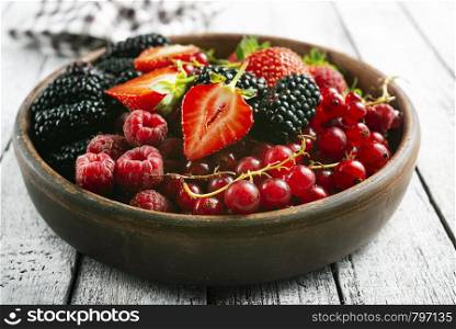 berries in bowl on a table, fresh berries