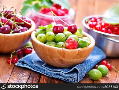 berries in bowls and on a table