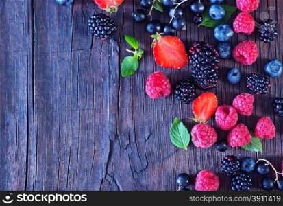 berries on the wooden table, mixed berries