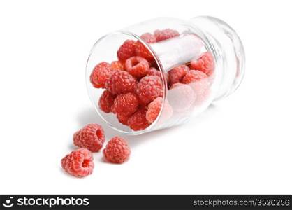 berries raspberries in a glass isolated on white