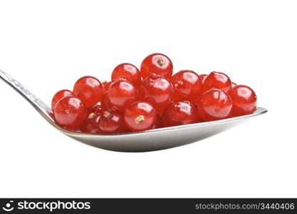 berries red currants in spoon isolated on a white background