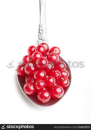 berries red currants in spoon isolated on a white background