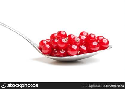 berries red currants in spoon isolated on a white background