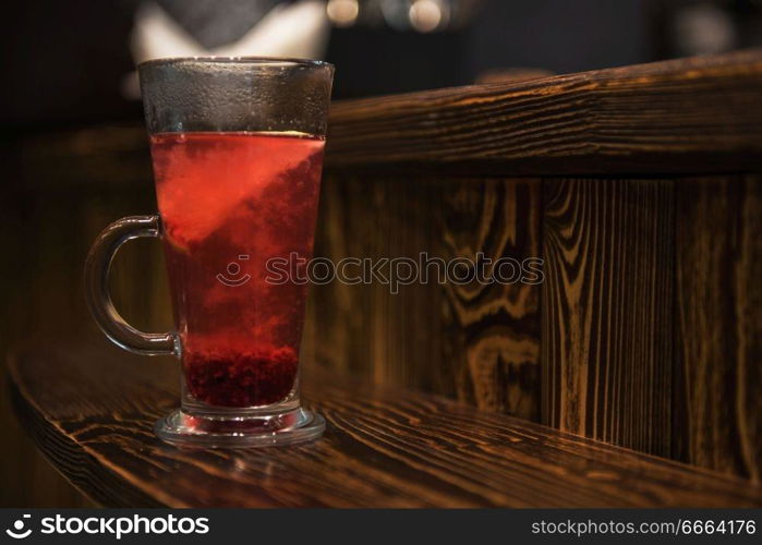 Berries tea on wooden background. Berries tea on wooden