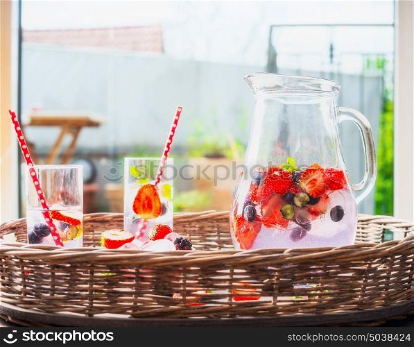 Berries Water, beverage in glass jug, front view