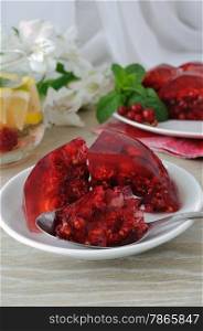 Berry jelly with fresh raspberries with red currants