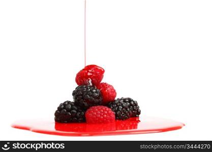 berry mixed pile in syrup isolated on white
