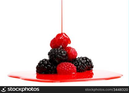 berry mixed pile in syrup isolated on white