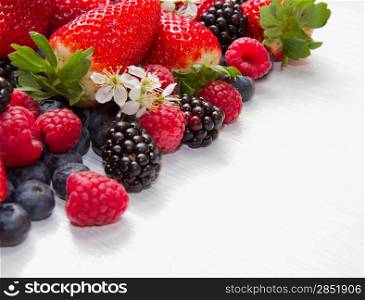 Berry over white Wood. Strawberries, Raspberries, Blueberry