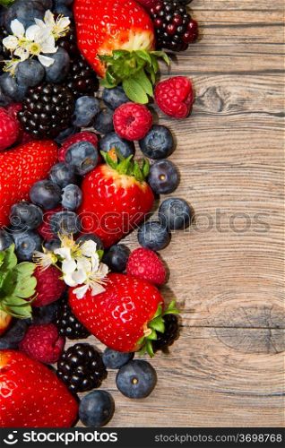 Berry over Wood. Strawberries, Raspberries, Blueberry