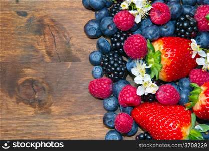 Berry over Wood. Strawberries, Raspberries, Blueberry
