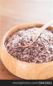 Berry rice in wooden bowl, stock photo