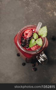 Berry smoothie on rustic background - Healthy eating, Detox or Diet concept