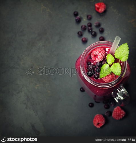 Berry smoothie on rustic background - Healthy eating, Detox or Diet concept