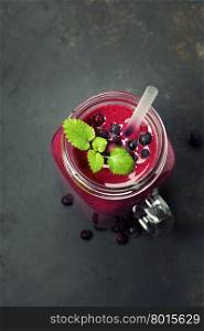Berry smoothie on rustic background - Healthy eating, Detox or Diet concept