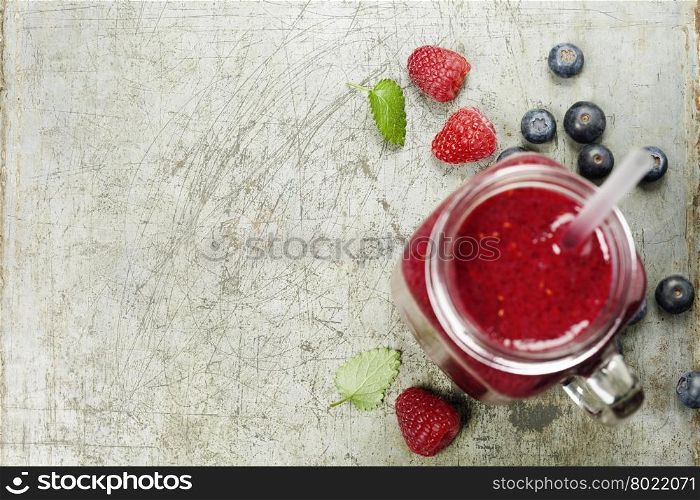 Berry smoothie on rustic background - Healthy eating, Detox or Diet concept