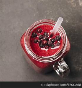 Berry smoothie on rustic wooden background - Detox, dieting, clean eating, vegetarian, vegan, fitness, healthy lifestyle concept