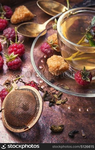 berry tea with raspberries. Autumn warming and anti-cold tea with raspberries