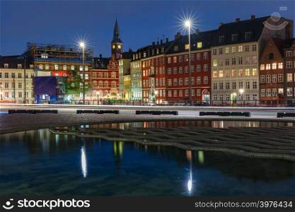 Bertel Thorvaldsen&rsquo;s Square, Copenhagen City Hall and colorful houses with their mirror reflection in reflecting pool at night, Copenhagen, capital of Denmark. Night Copenhagen, Denmark