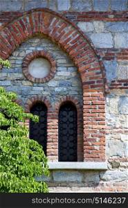 besnate cross church varese italy the old rose window and mosaic wall in the sky sunny day bush