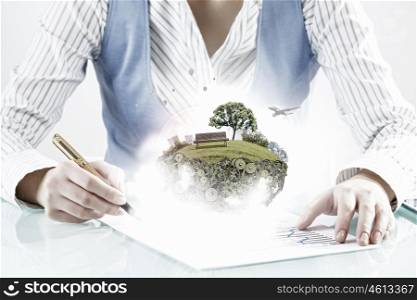Best development project. Close view of businesswoman signing construction project documents