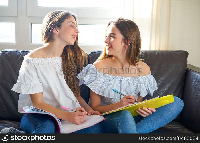 best friend girls studying homework at home. best friend girls studying homework at home in sofa