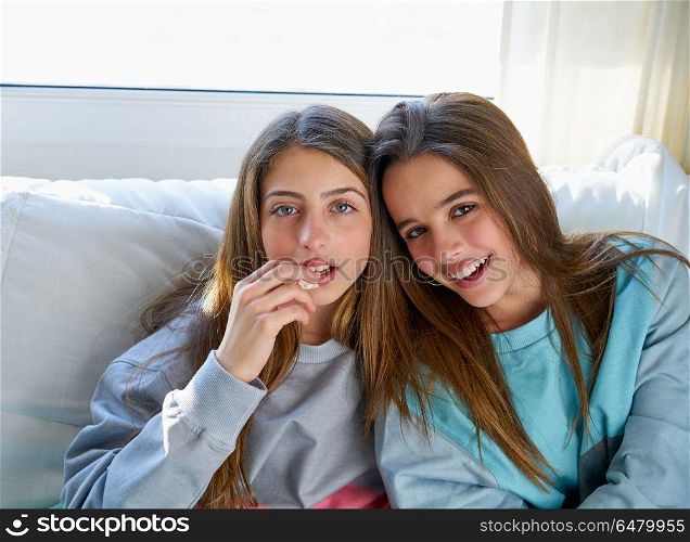 best friend girls watching TV cinema best friend girls watching . best friend girls portrait watching TV cinema at home with popcorn
