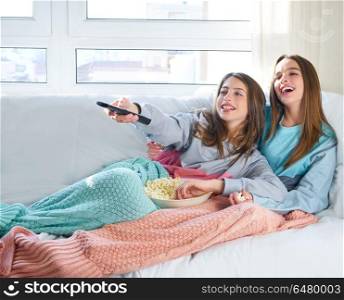 best friend girls watching TV cinema best friend girls watching . best friend girls watching TV cinema at home with popcorn