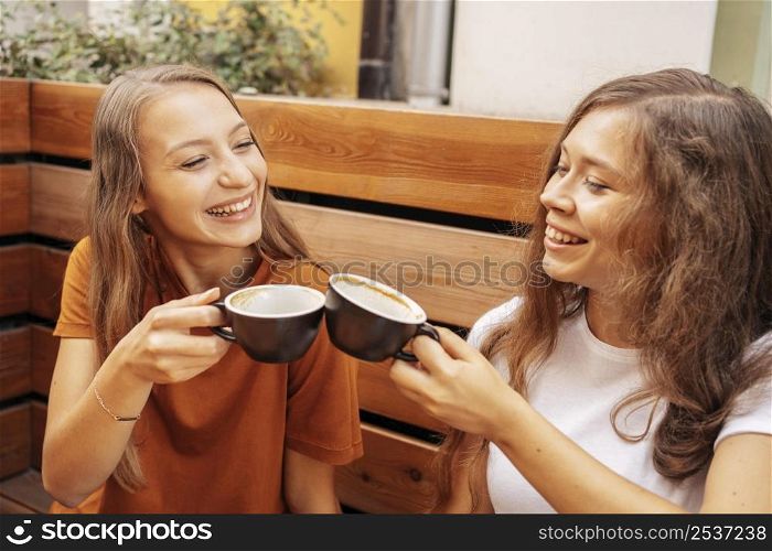 best friends drinking coffee together