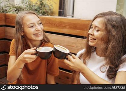 best friends drinking coffee together