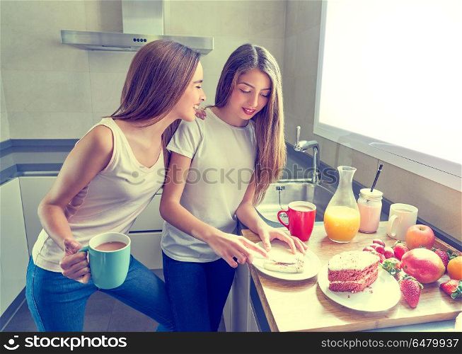 best friends girls teens breakfast in kitchen. best friends girls teens breakfast in kitchen having fun