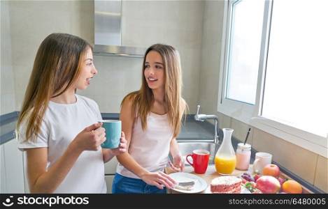 best friends girls teens breakfast in kitchen. best friends girls teens breakfast in kitchen having fun