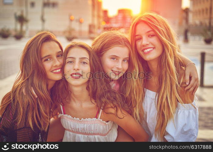 Best friends teen girls at sunset in the city filtered image