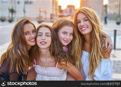 Best friends teen girls at sunset in the city group