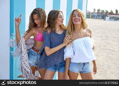 Best friends teen girls group happy in a summer blue stripes background