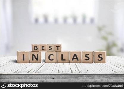 Best in class sign on a wooden table in a bright classroom