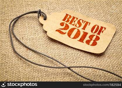 Best of 2018 sign - a paper price tag with a twine iagainst burlap canvas