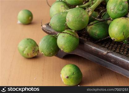 betel nut on a wooden tray.