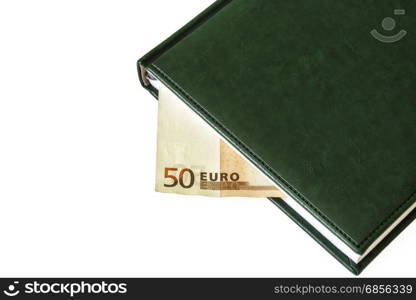 Between the sheets of the closed diary is visible part of the bill of 50 euros