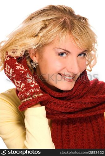Beutiful blond girl with blue eyes in winter clothing touching her hair