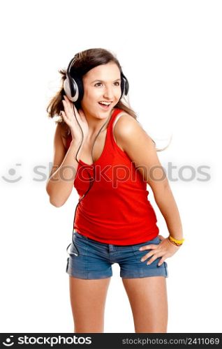 Beutiful girl listen music isolated on white