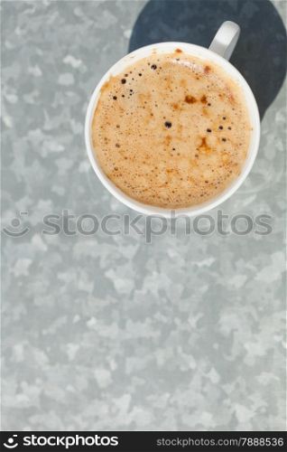 Beverage. Cup of coffee cappuccino with froth hot drink on gray background. Blank copy space.