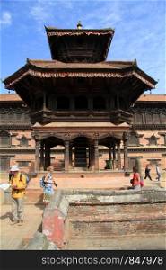 BHAKTAPUR, NEPAL - CIRCA NOVEMBER 2013 Tourists near pagoda on the Durbar square