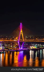 Bhumibol suspension bridge cross over Chao Phraya River at night in Bangkok city, Thailand
