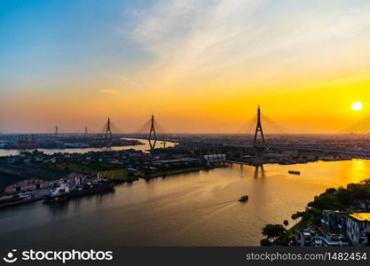 Bhumibol suspension bridge cross over Chao Phraya River at sunset in Bangkok city, Thailand