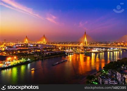 Bhumibol suspension bridge cross over Chao Phraya River with sunrise in Bangkok city, Thailand